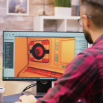 Close up shot of game developer working on a new level of game